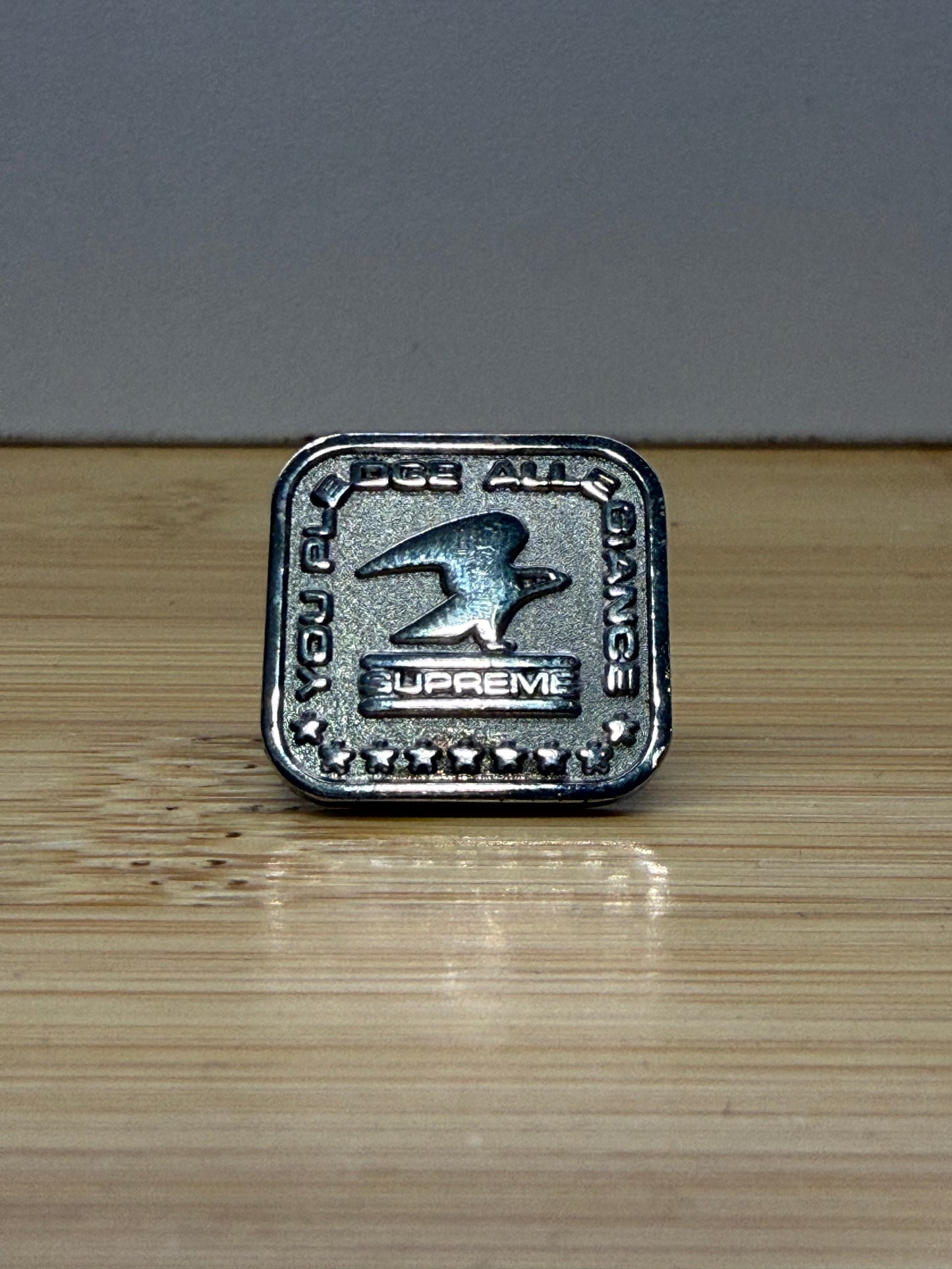 FW19 SUPREME PLEDGE ALLEGIANCE PIN - SILVER