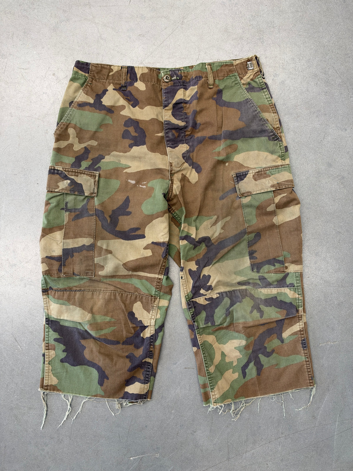 VINTAGE WOODLAND CAMO CARGO PANTS CUT TO LONG SHORTS (FADED TAG)