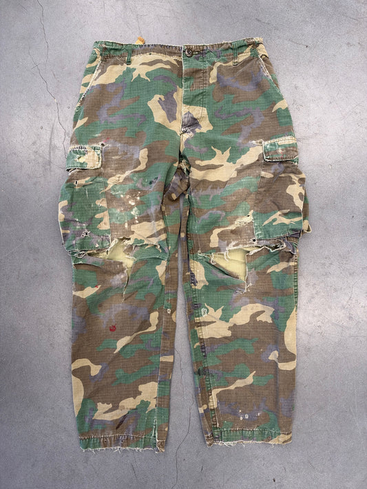 1980S DISTRESSED MILITARY CLASS 2 CAMOUFLAGE PANTS - GREEN CAMO