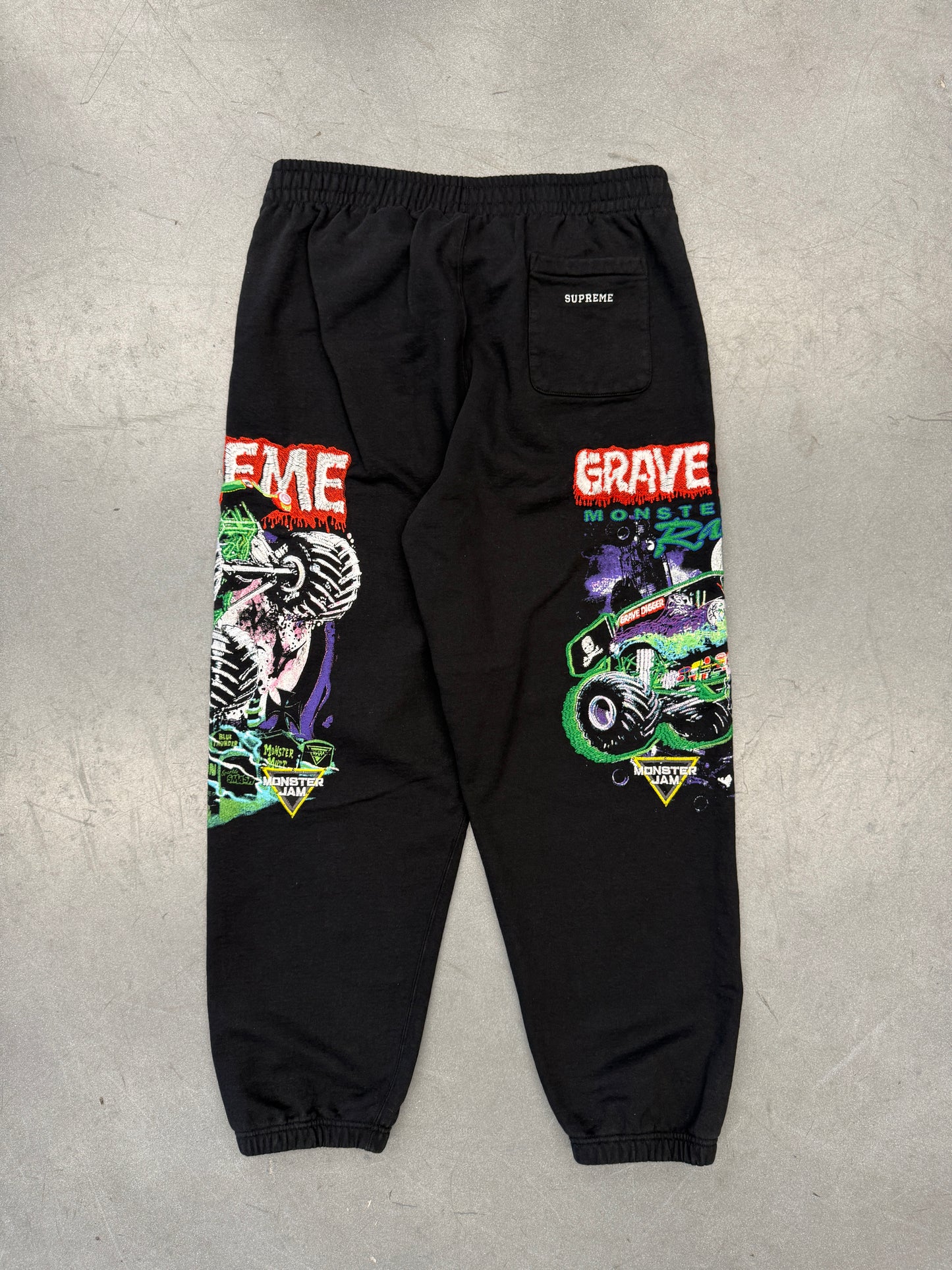 SS26 SUPREME MONSTER JAM GRAVE DIGGER GREEN/PURPLE SWEATPANTS