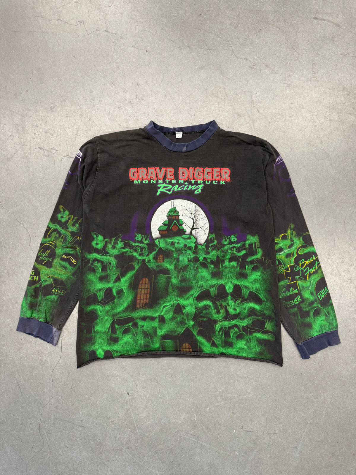 90'S GRAVE DIGGER MONSTER TRUCK RACING AOP LONG SLEEVE FADED TEE (L TAG)