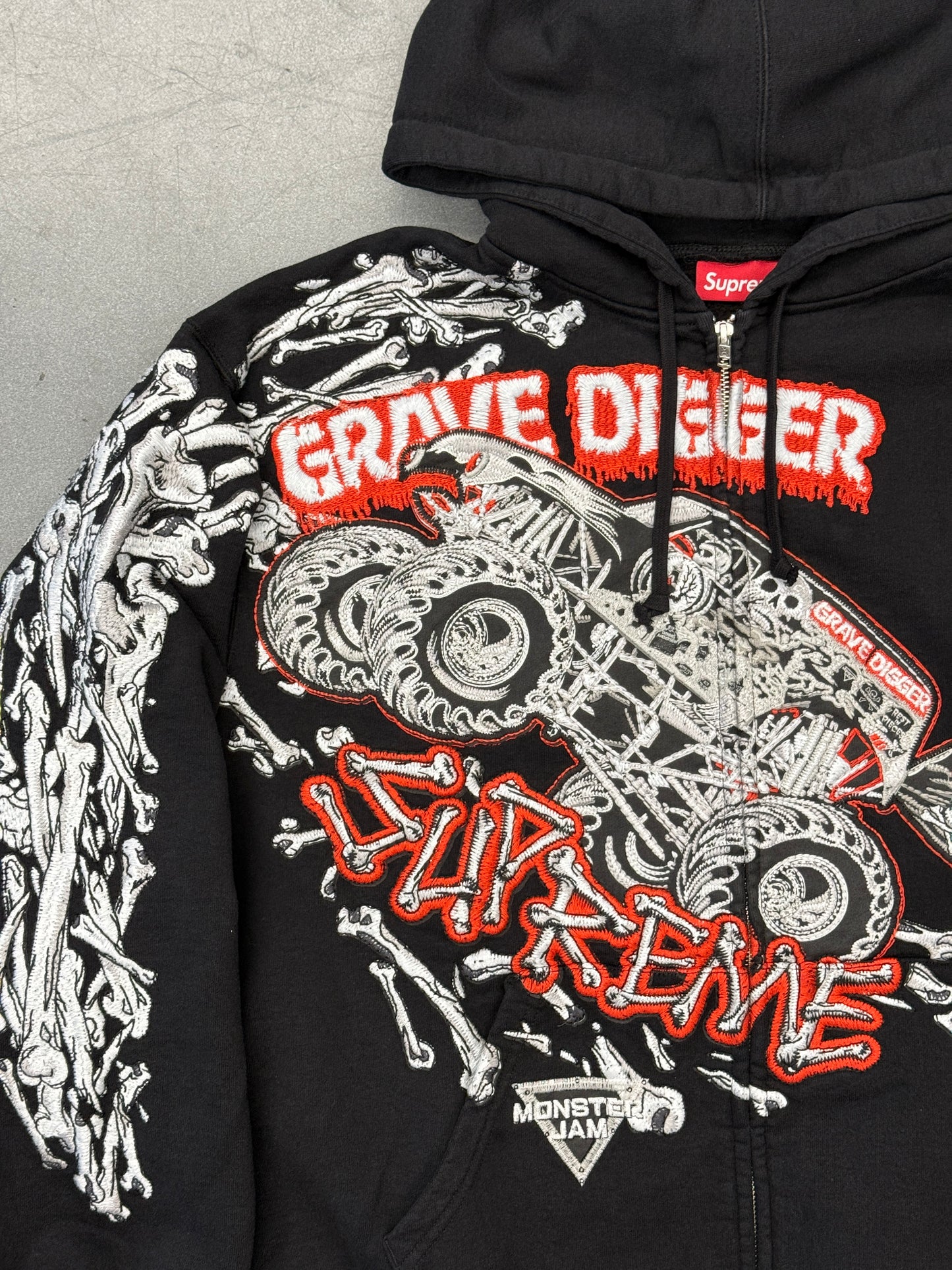 SS26 SUPREME MONSTER JAM GRAVE DIGGER BONES ZIP UP HOODED SWEATSHIRT