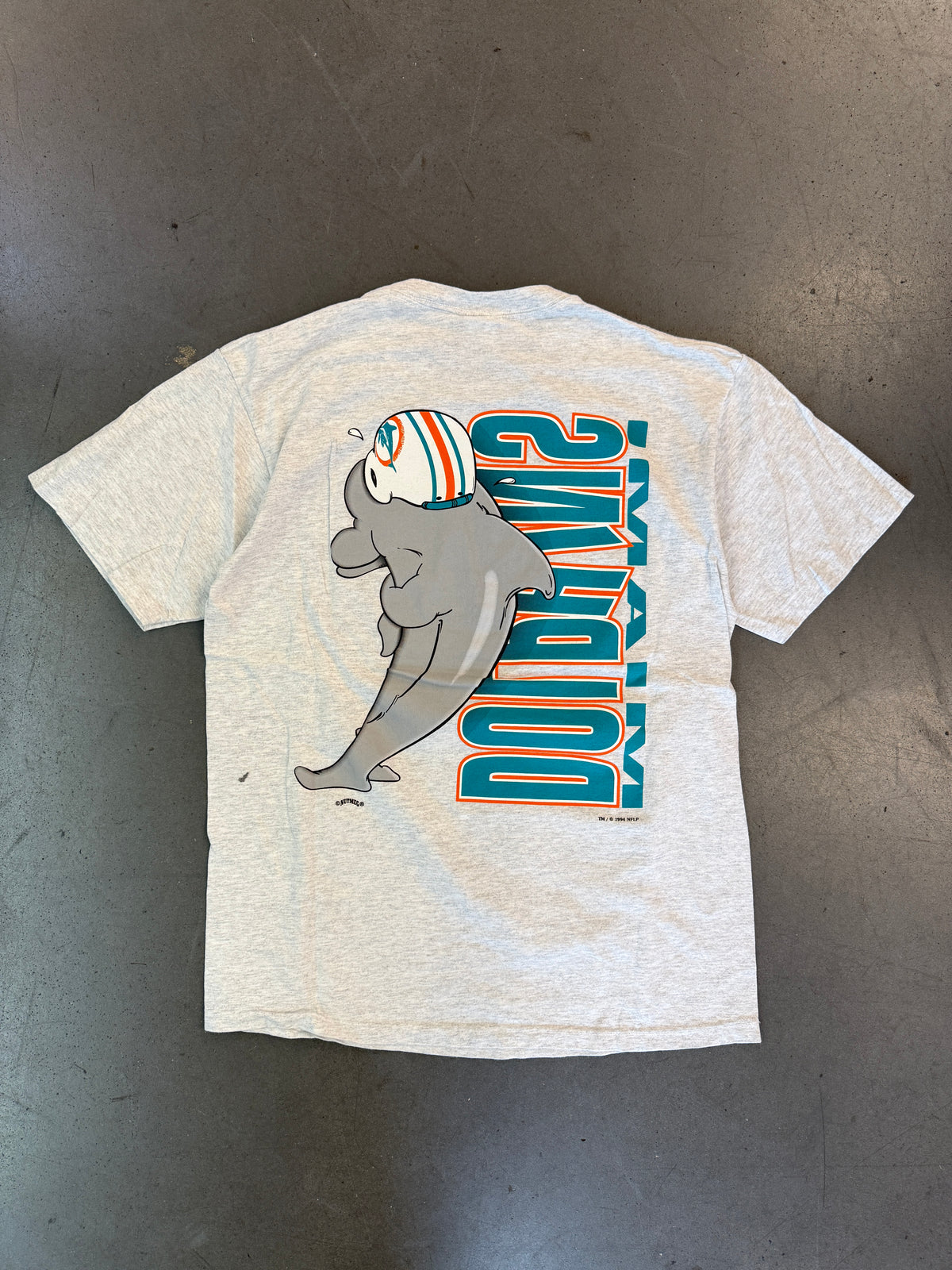 1994 MIAMI DOLPHINS VERTICAL SPELL-OUT ANIMATED DOLPHIN TEE (NUTMEG TAG)