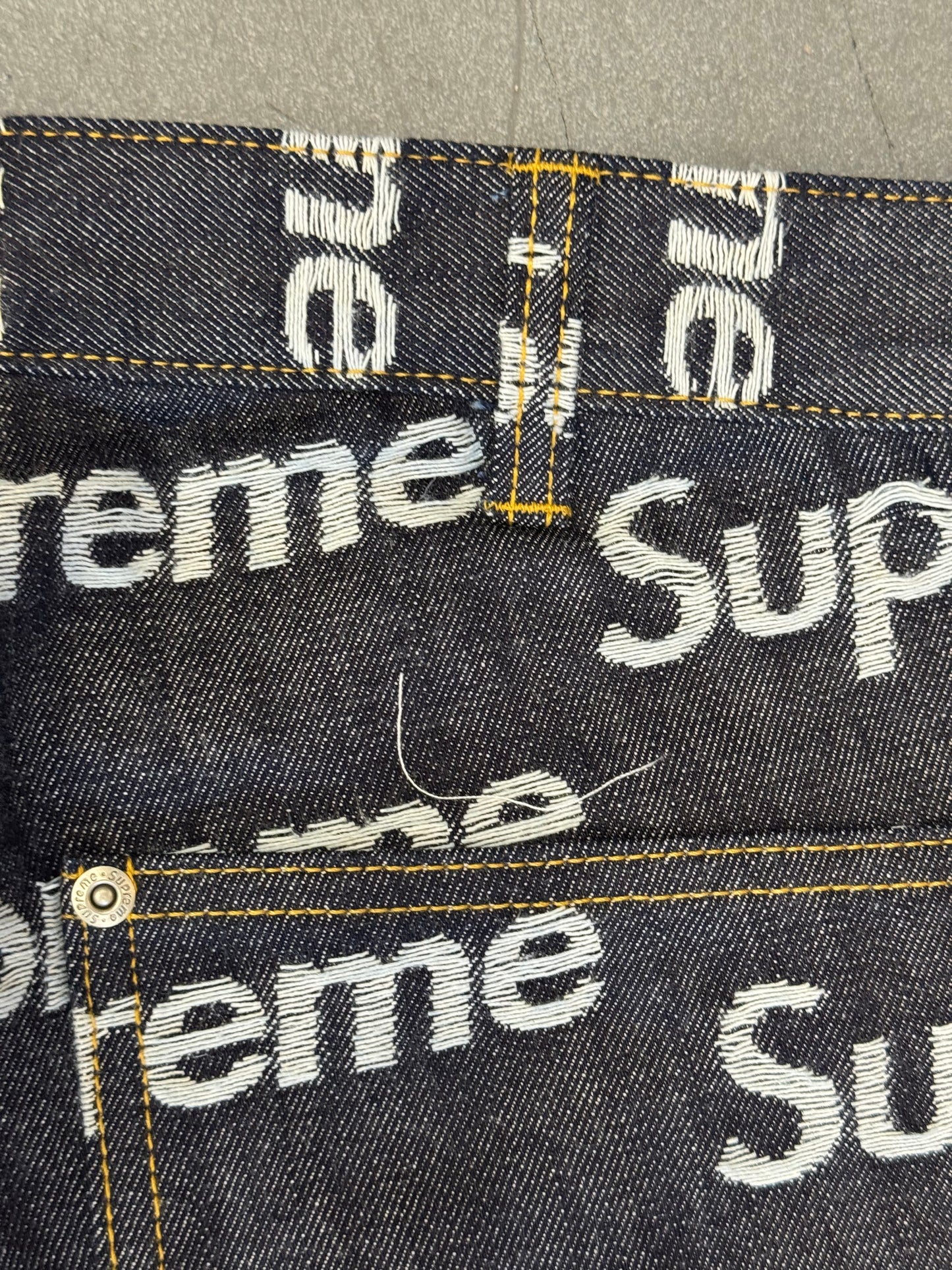FW25 SUPREME JACQUARD LOGOS DOUBLE KNEE DENIM PAINTER JEAN - RIGID INDIGO