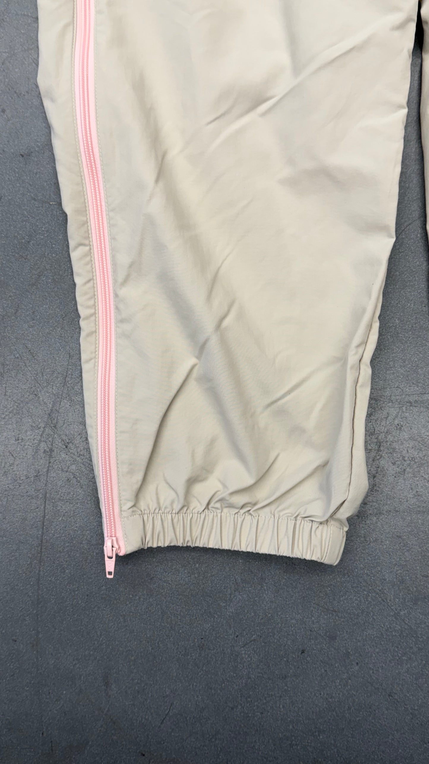 SS25 SUPREME CONTRAST ZIP WARM UP PANT - STONE/PINK