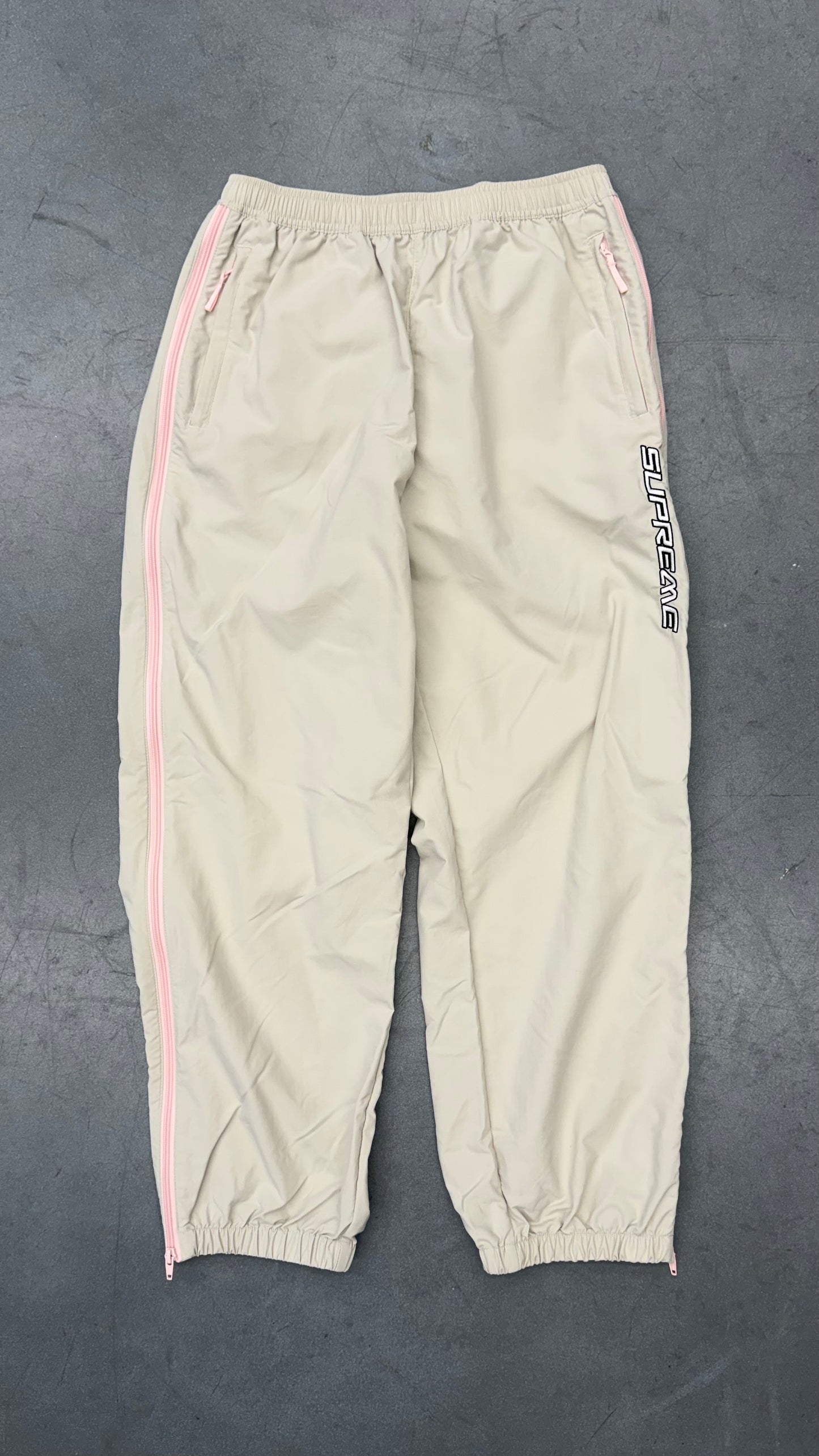 SS25 SUPREME CONTRAST ZIP WARM UP PANT - STONE/PINK