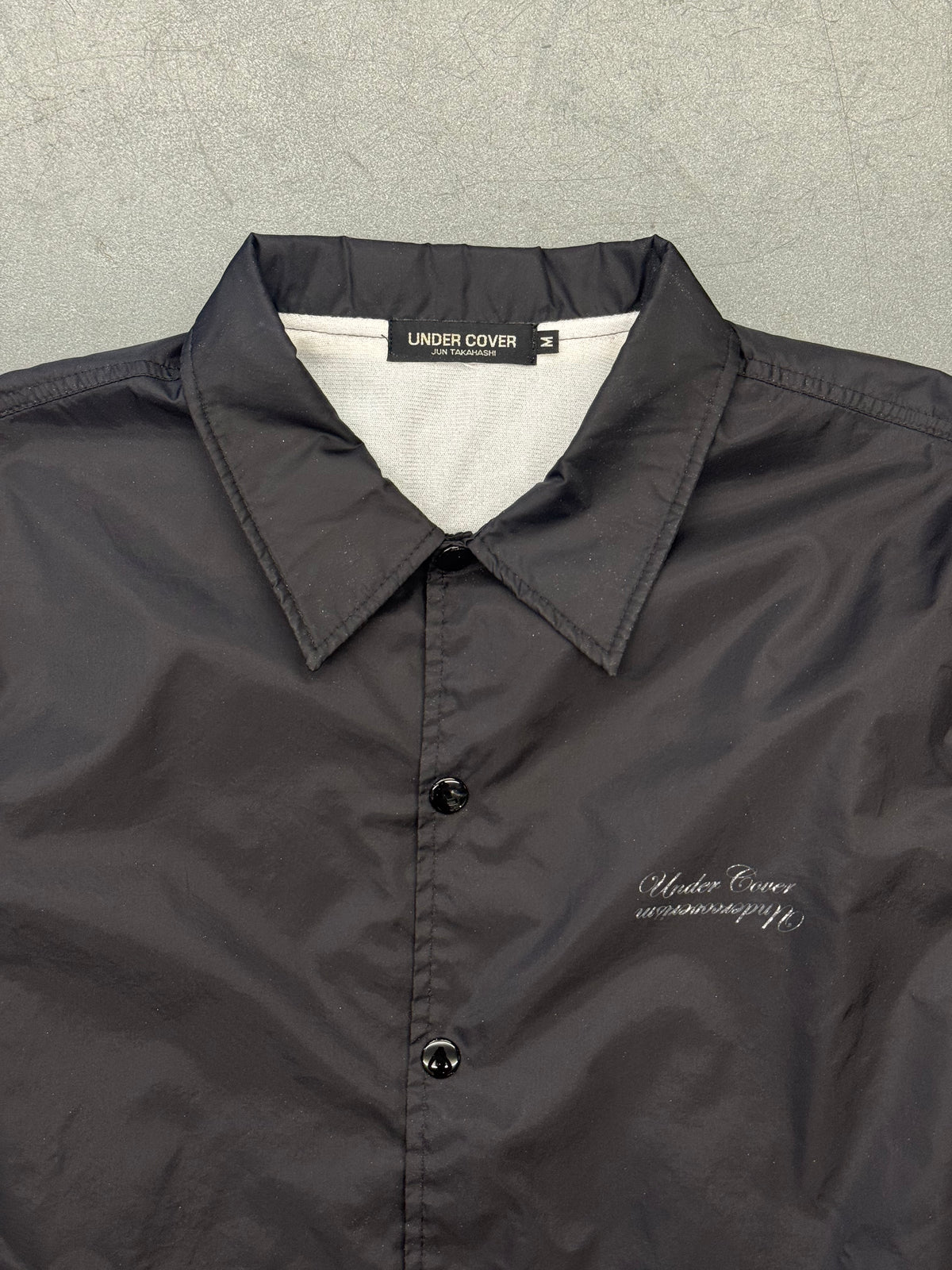 UNDERCOVER COACH JACKET - BLACK