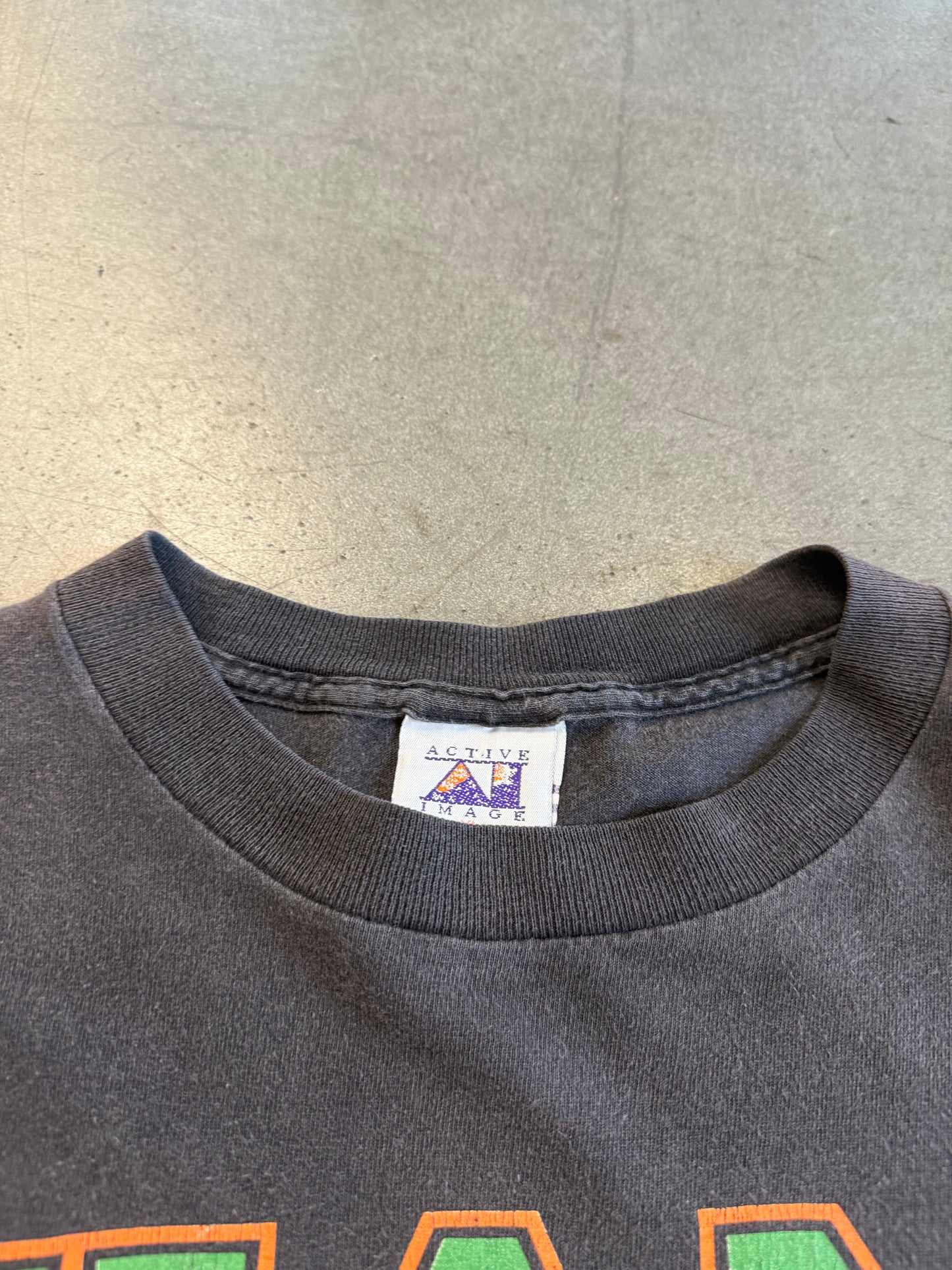 1994 MIAMI HURRICANES SEBASTIAN BASKETBALL BREAKTHROUGH SHATTERED TEE (ACTIVE IMAGE TAG)