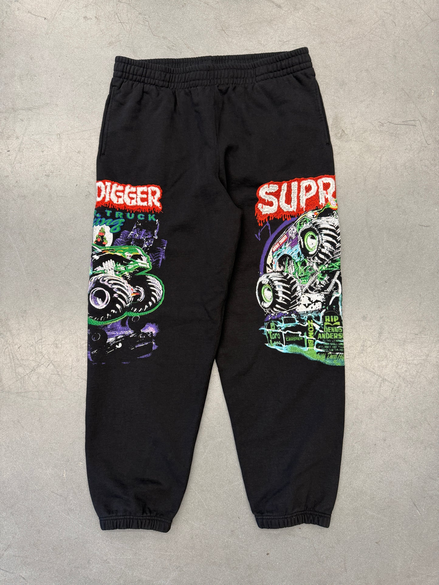 SS26 SUPREME MONSTER JAM GRAVE DIGGER GREEN/PURPLE SWEATPANTS