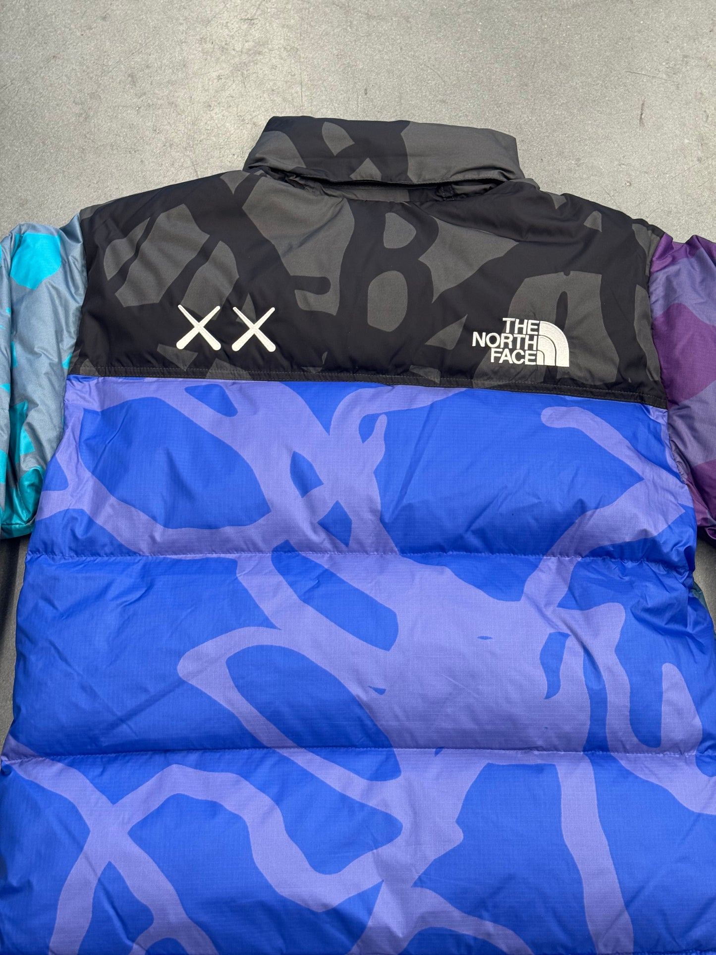 KAWS X THE NORTH FACE RETRO 1996 JACKET - MONTEREY BLUE NUPTSE PRINT