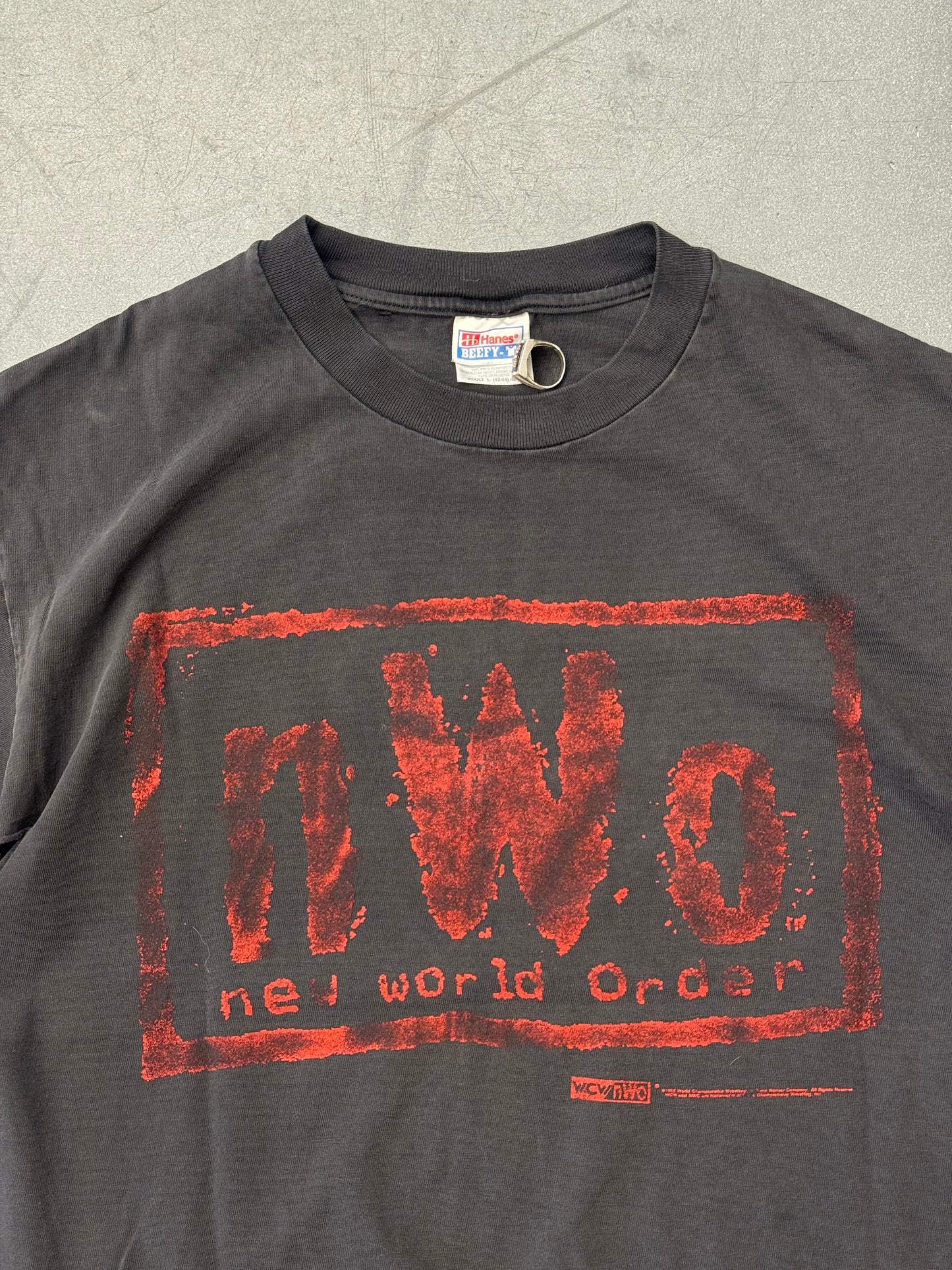 1998 N.W.O NEW WORLD ORDER "BAD HAS ARRIVED, AND IT'S HERE TO STAY." TEE (HANES BEEFY-T TAG)