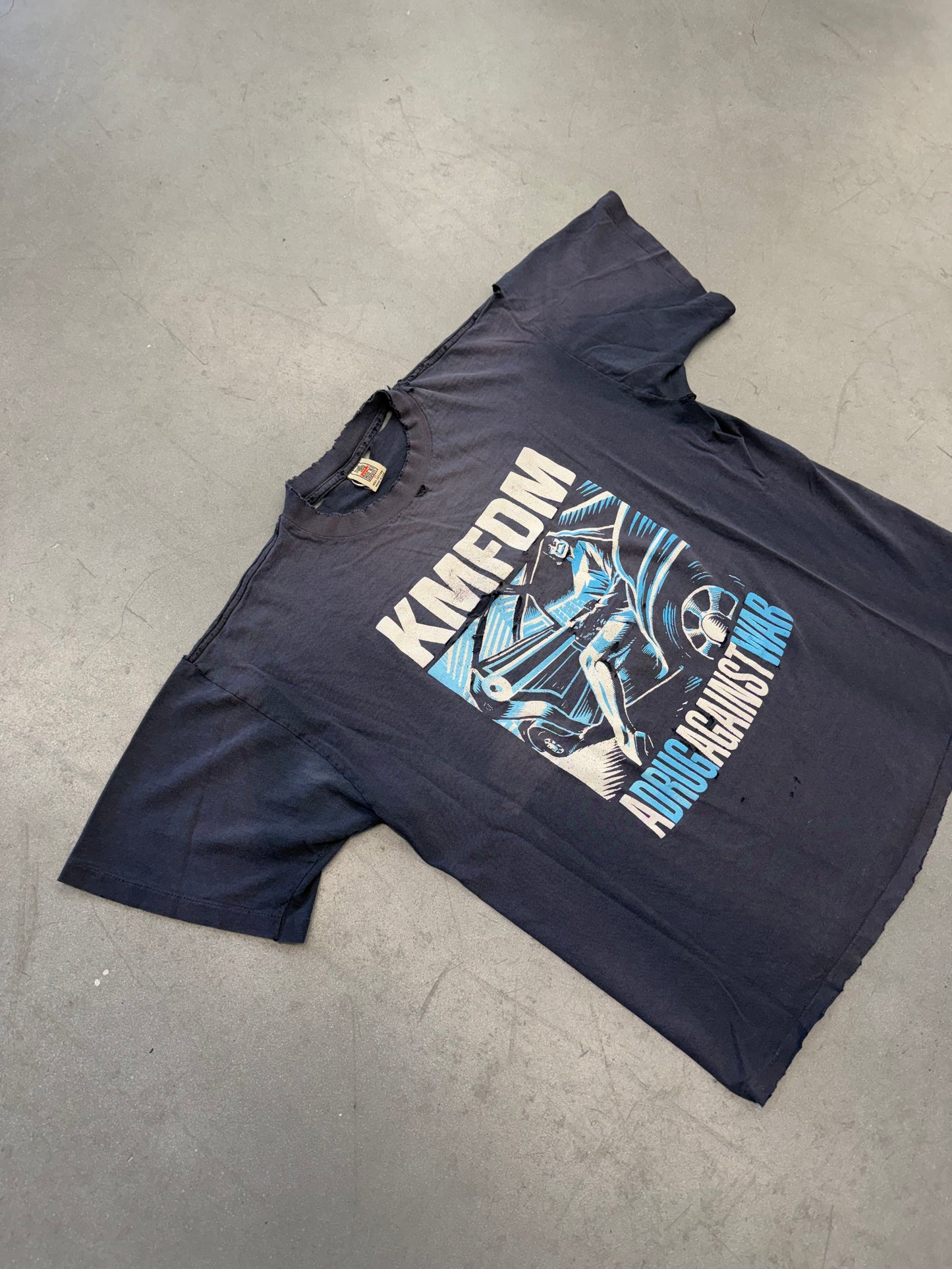 KMFDM A DRUG AGAINST WAR TEE (JUST SAY ROCK TAG)