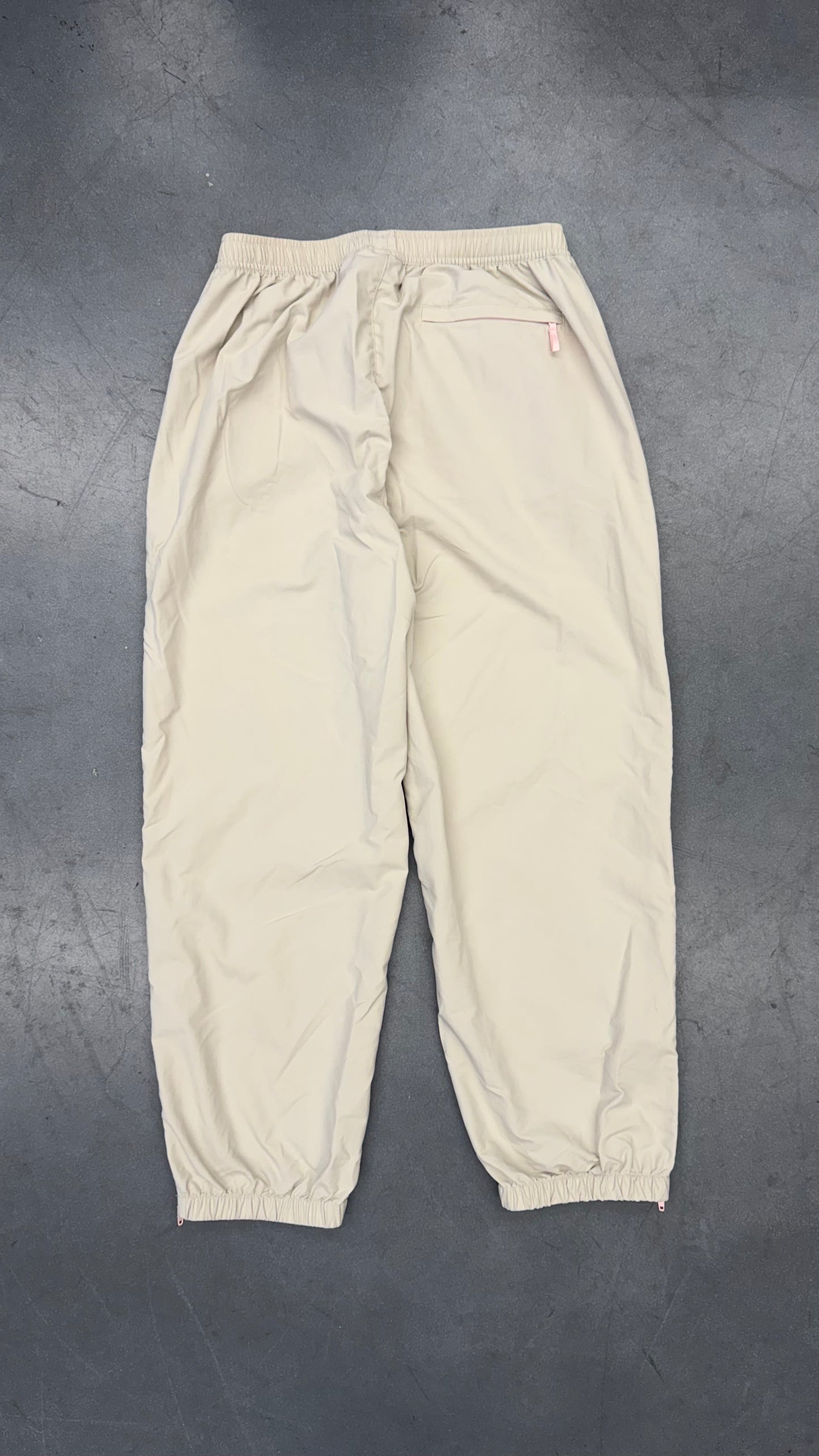 SS25 SUPREME CONTRAST ZIP WARM UP PANT - STONE/PINK