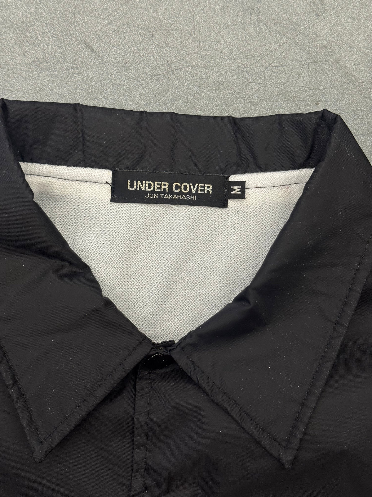 UNDERCOVER COACH JACKET - BLACK