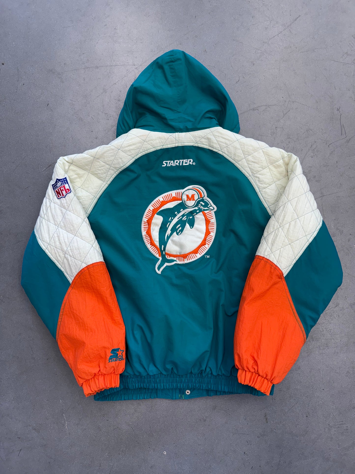 90'S STARTER MIAMI DOLPHINS DIAMOND PATTERN SLEEVE PUFFER JACKET (XL)